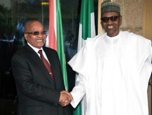 Nigerian President Muhammadu Buhari, right, shakes hand with his South African counterpart Jacob Zuma during their meeting at the presidential villa in Abuja. 